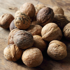 Walnuts on wooden background