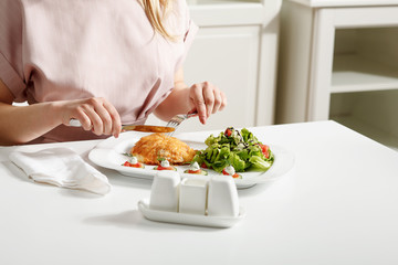 Obraz na płótnie Canvas Fried beef with salad on white table. Stock image. Horizontal