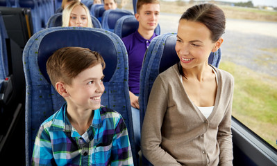 happy family riding in travel bus