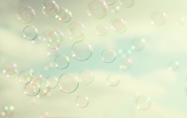 Soap bubbles floating in the air against sky