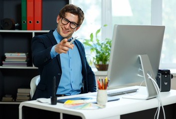 Fototapeta premium Handsome young man working from home office