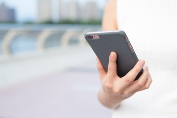 Woman use smartphone at city
