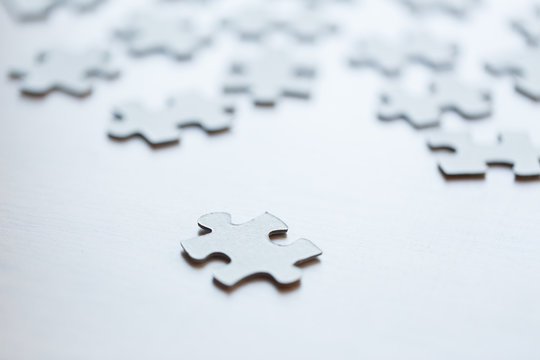 close up of puzzle pieces on table
