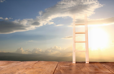 abstract image of ladder reaching into the sky