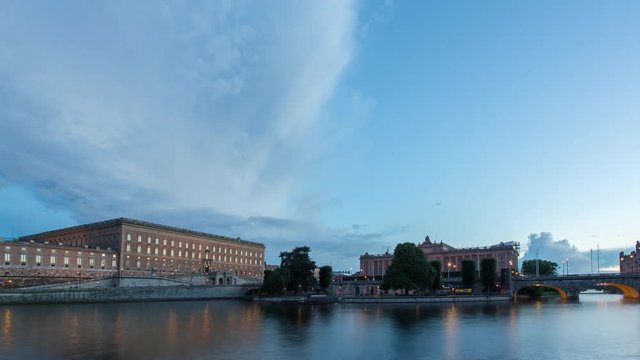 The Royal Palace in the city center of Stockholm with waterway Stockholm str&ouml;m in the foreground and the swedish parliament "Riksdagen" to the right