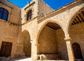 Fototapeta na wymiar Ayia Napa monastery, gates connected to the rampart, surrounding
