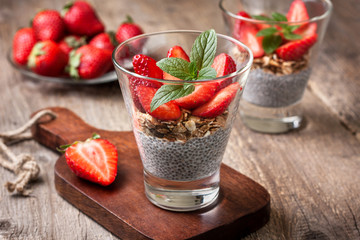 Breakfast with chia pudding, strawberries and muesli