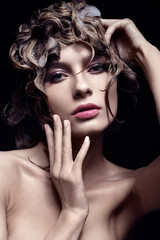 Beautiful girl with wat hairstyle and bright makeup. Beauty face.
