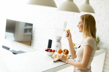 Woman preparing smoothie