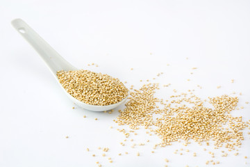 Quinoa in a spoon isolated on white background
