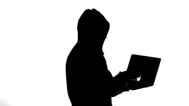 Hacker typing on notebook 4k