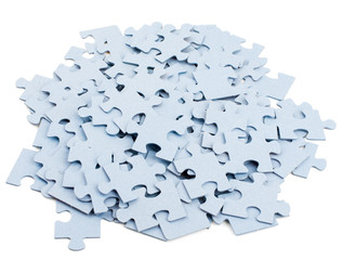Pile of grey blank puzzle pieces 