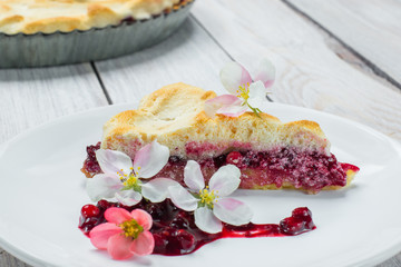 Slice of Fruit Pie with Flowers and Currant-Blueberry Jam