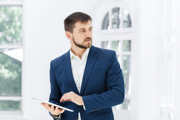 The elegant businessman in  the office