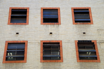 detail windows of industrial building on urban city street