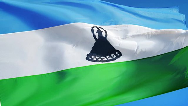 Lesotho flag waving in slow motion against clean blue sky, seamlessly looped, close up, isolated on alpha channel with black and white luminance matte, perfect for film, news, digital composition