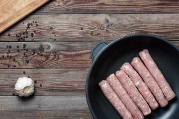 Raw Sausages in a Pan
