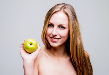 Beautiful naked woman with the apple.