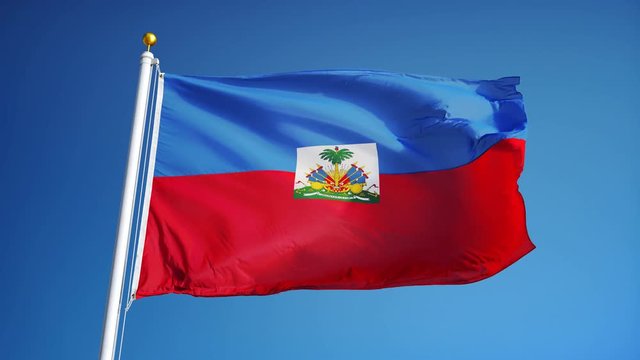 Haiti flag waving in slow motion against clean blue sky, seamlessly looped, close up, isolated on alpha channel with black and white luminance matte, perfect for film, news, digital composition