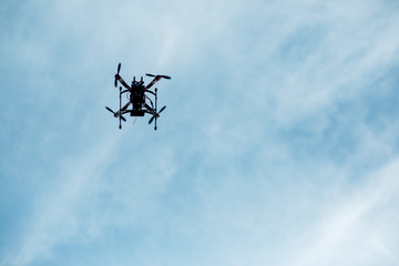 Fototapeta na wymiar flying drone with camera on the sky