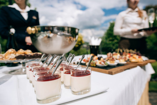 Catering Services In Restaurant Outdoor On Wedding Ceremony In The Park. Food And Glass Of Champagne