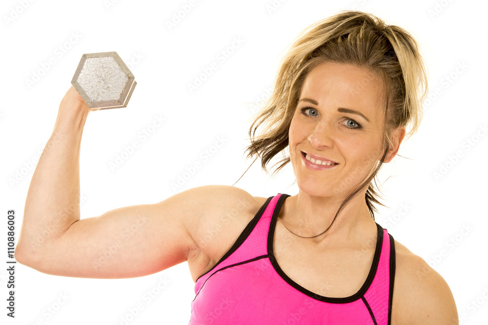 Wall mural strong woman in pink tank top flex one arm