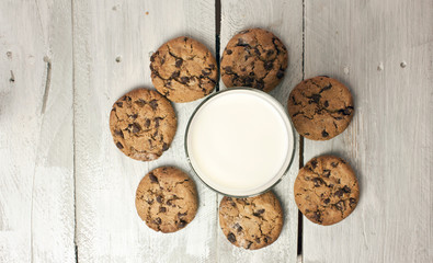 Glass of milk with traditional American chocolate chips cookies