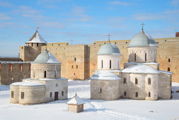 Fototapeta na wymiar St. Nicholas Church and Cathedral of the assumption within the walls of the Ivangorod fortress, winter day. Russia