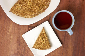 Cup of tea and piece of cake, shot from above
