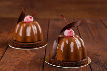 Chocolate and cherry mousse dessert with glaze