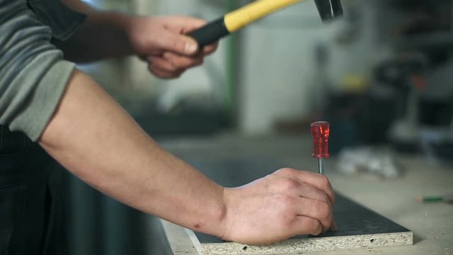 Man working with a hammer