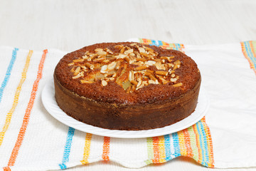 Pie with pears, peanuts and cookies-sticks