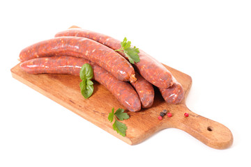 raw sausage on board isolated