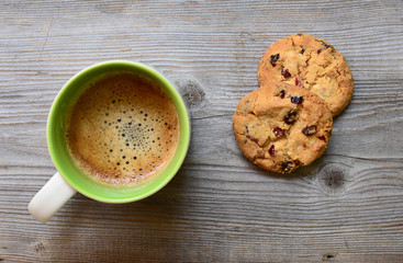 Coffee and cookies on wooden background