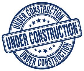 under construction blue grunge round vintage rubber stamp