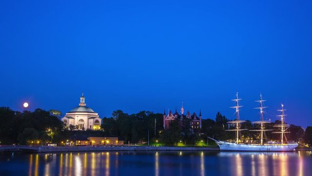 Time lapse of the old ship Afchapman moored by Skeppsholmen in central Stockholm, Sweden as the moon rises