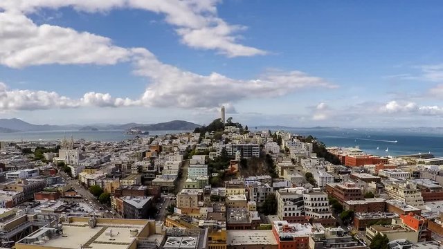 Afternoon time lapse with zoom of clouds and boats moving across San Francisco Bay.
