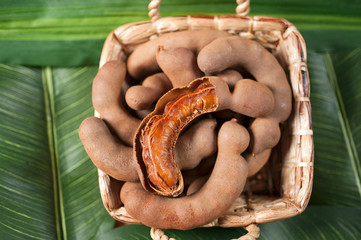 stack tamarinds in basket on Banana leaf