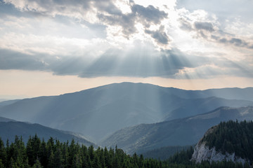 Sun shines over mountains