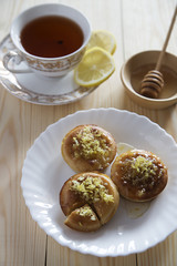 Lemon cakes, tea and honey