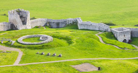 old ruins and green field