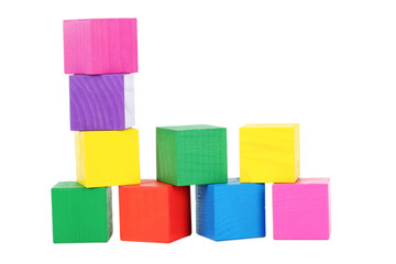 Colorful wooden toy cubes isolated on a white