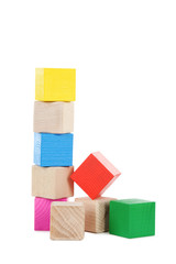 Colorful wooden toy cubes isolated on a white