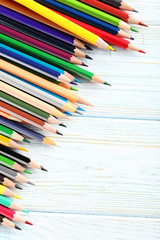 Obraz premium Drawing colourful pencils on a wooden background