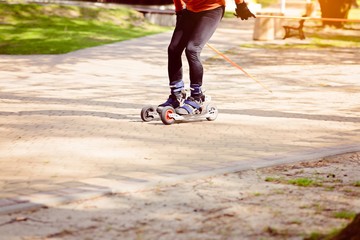 Man cross country skiing with roller ski