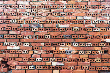 Old wall of red briks tiled background, regular block texture