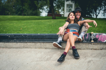 Young urban skater couple in the city