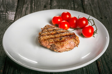 steak and tomatoes on a plate
