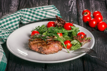 steak and salad on a plate