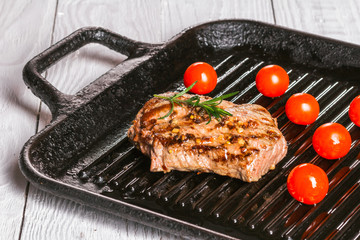 steak and cherry tomatoes in a pan